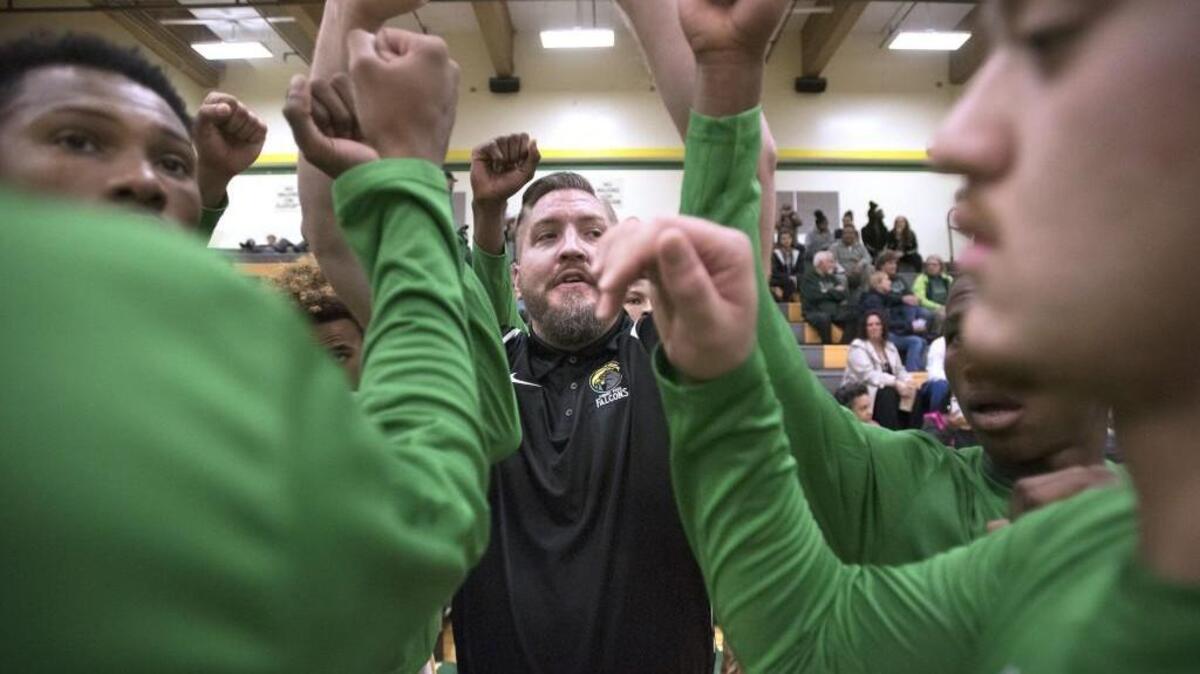 Foss head coach Mike Cocke fires up the Falcons during a boys basketball game against Timberline at Foss High School in Tacoma on Nov. 29, 2016.