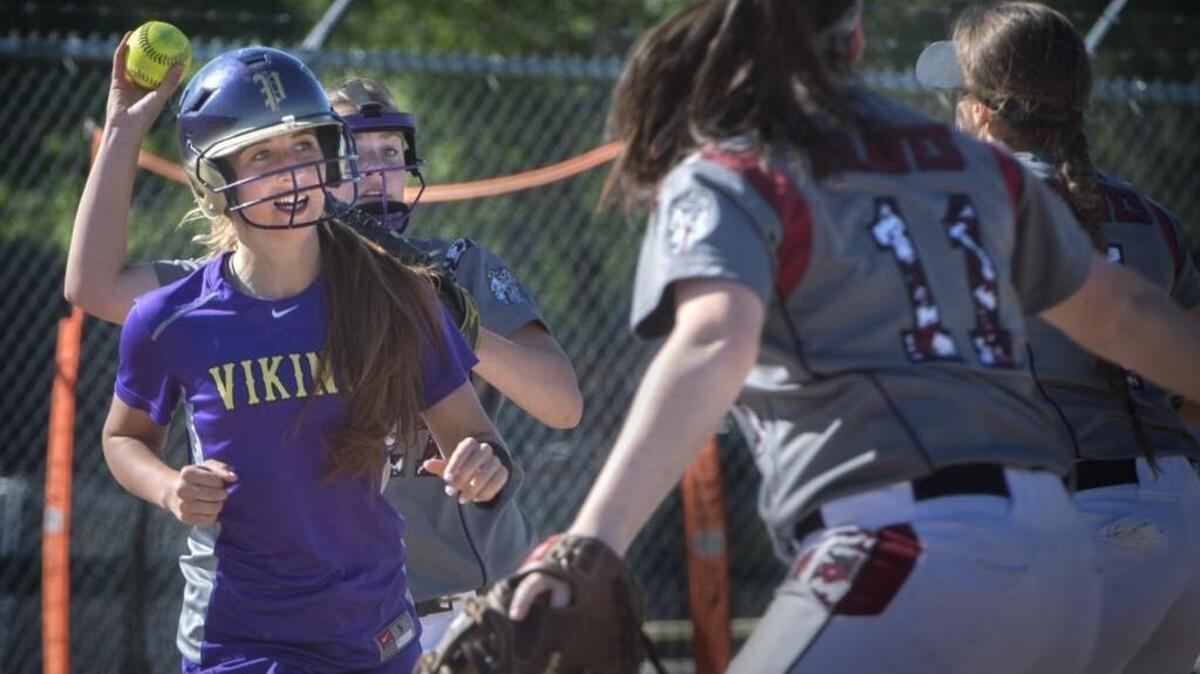 Bethel’s Sophia Struna tags out a Puyallup runner and fires the ball to Kaylee Fish (11) in an attempt for a double play on Tuesday.