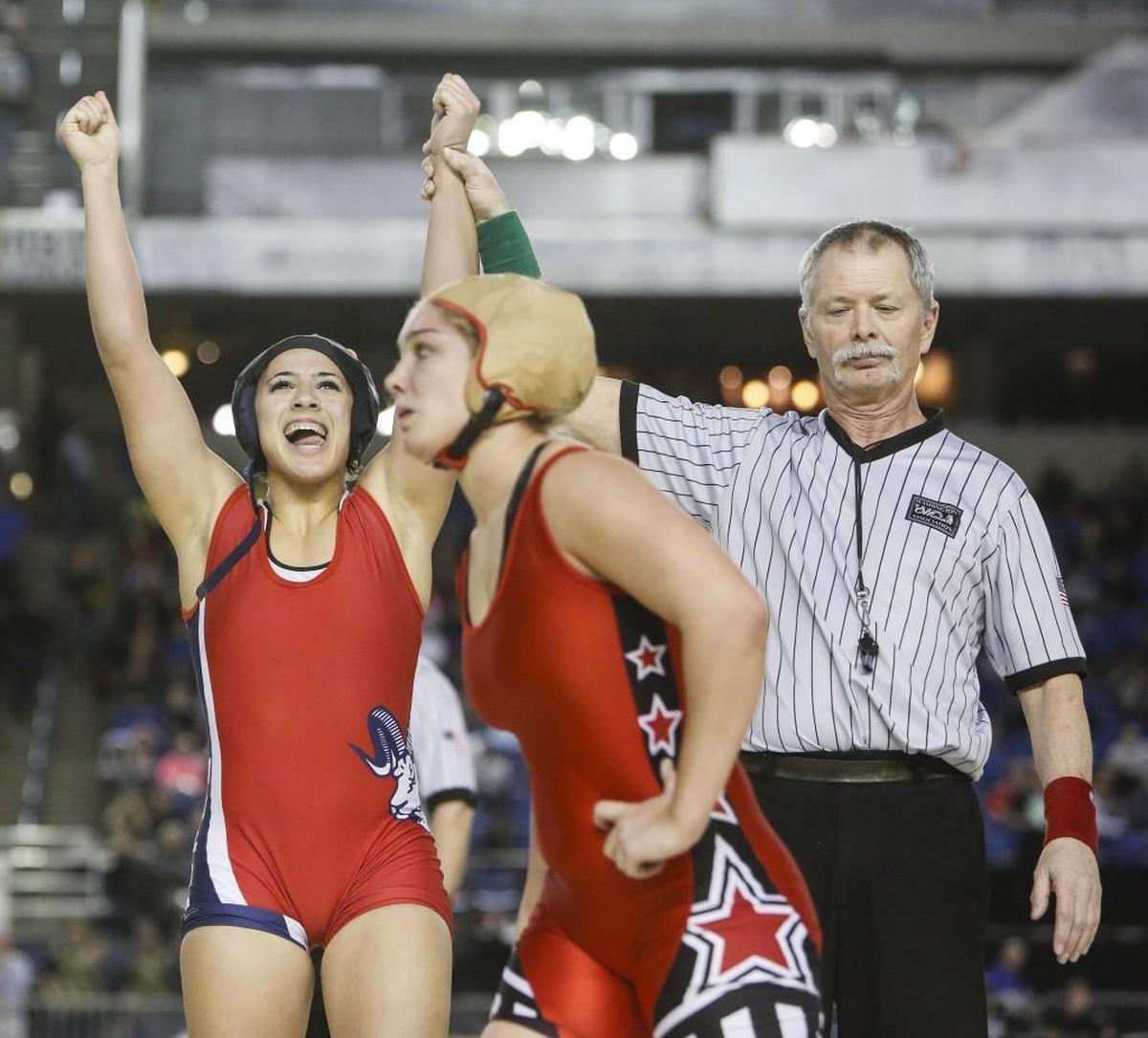 Wilson's Jasmine Parker-Borrero celebrates after defeating Yelm's Ariana Zenke in the girls 145 pound championship match at Mat Classic XXIX at the Tacoma Dome in Tacoma, Wash., on Saturday, February 18, 2017.
