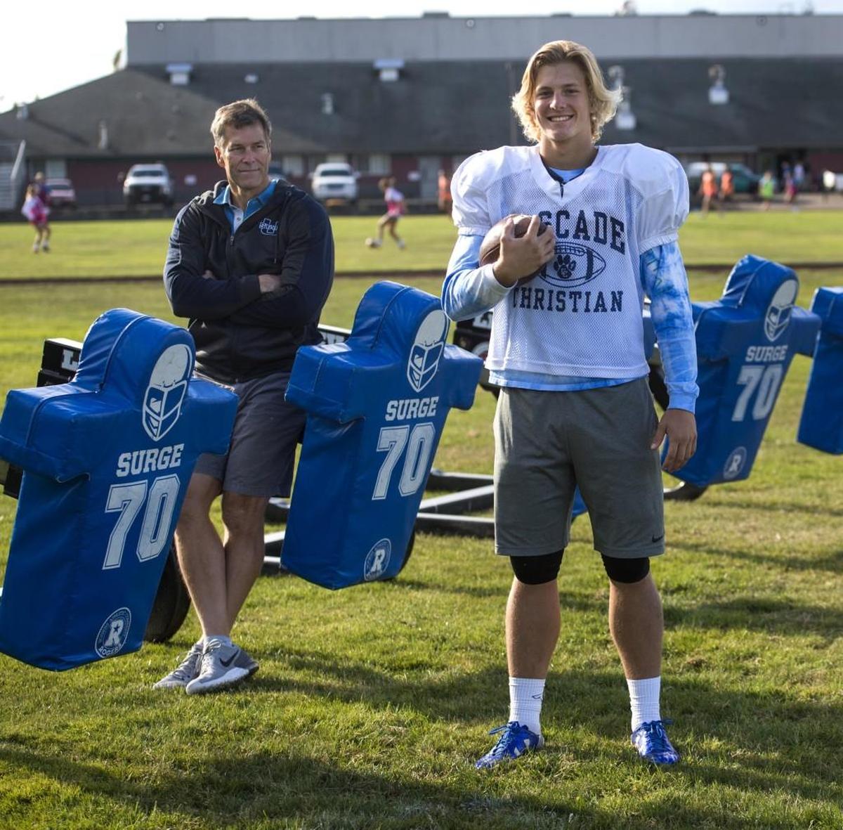 Cascade Christian running back Madden Tobeck, right, is the son of former WSU and Seattle Seahawks center Robbie Tobeck, left. Photo taken in Puyallup on Wednesday, Oct. 11, 2017.