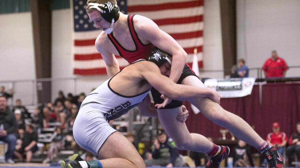Orting's Ben Gore (top) works to control Bonney Lake's Avery Meyer during their 145-pound championship final match at the Gut Check Wrestling Tournament at the Kitsap County Fairgrounds in Silverdale on Saturday, Jan. 9, 2016. Gore won the match, 11-7.