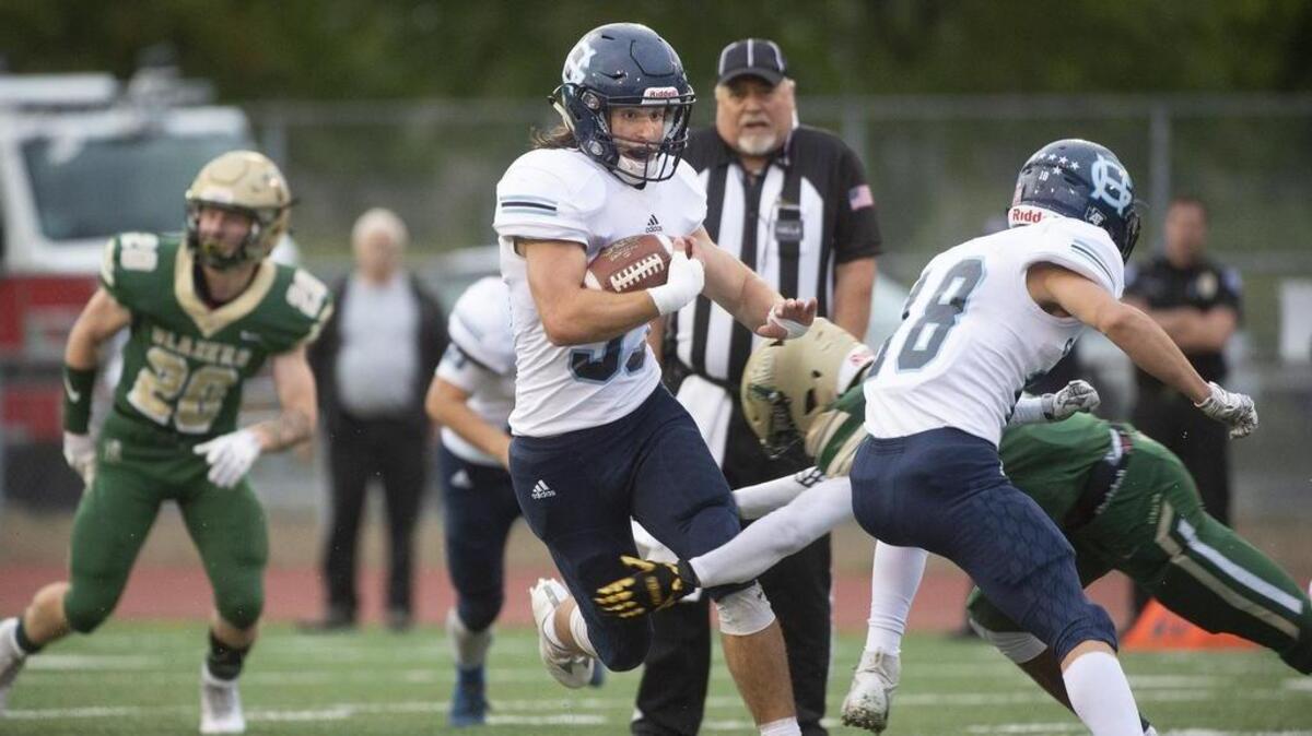 Gig Harbor running back Simon Plymate weaves through the Timberline defense during Friday night’s football game at South Sound Stadium in Lacey on Sept.14, 2018.