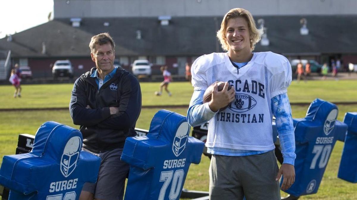 Cascade Christian running back Madden Tobeck, right, is the son of former WSU and Seattle Seahawks center Robbie Tobeck, left. Photo taken in Puyallup on Wednesday, Oct. 11, 2017.
