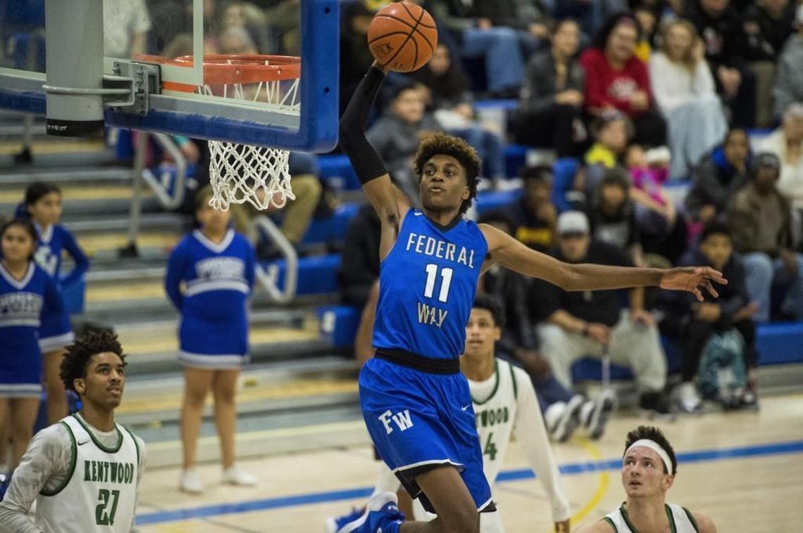 Federal Way's Jaden McDaniels throws down a dunk in the third quarter. Federal Way played Kentwood in a basketball game to decide the 4A NPSL title at Tahoma High School in Maple Valley, Wash., on Saturday, Feb. 3, 2018.