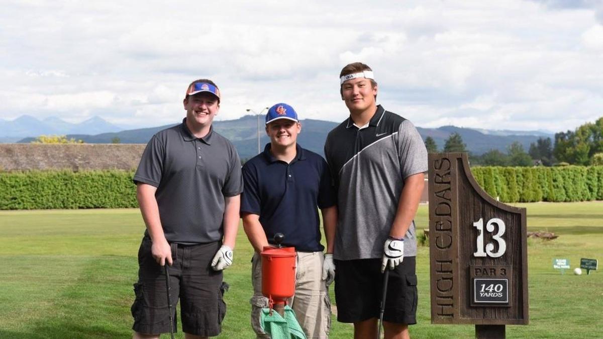 Graham-Kapowsin’s Foster Sarell, right, finds some time to relax and play a round of golf with classmates, and teammates, with Ian Kurle, left, and Brandon Becker. The first practices of the 2016-17 high school football season begin Aug. 17.