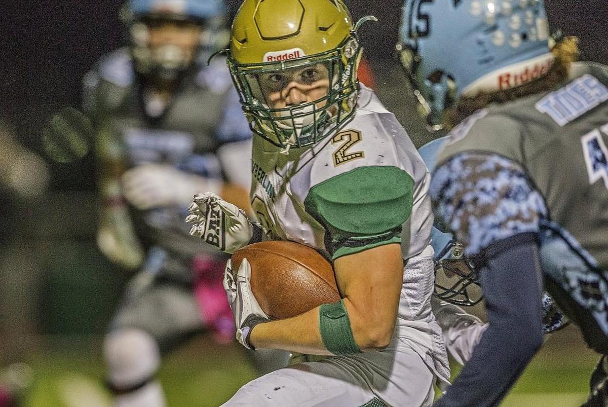 Timberline's Michael Barnes (2) runs for a first down to set up the Blazers' second touchdown during the Timberline vs. Gig Harbor football game at Anderson Field in Purdy, Wash., Friday, Oct. 13, 2017.
