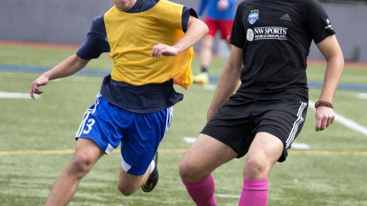 Senior Stadium midfielder Paul Wadsworth, right, maneuvering around Logan Barker, will play for PLU next season. Wadsworth earned offensive player of the year in the 3A Pierce County League.