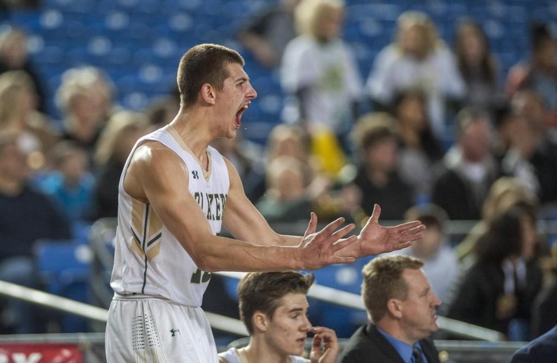 Erik Stevenson of Timberline High School can't sit on the bench for long in the boys basketball class 3A state tournament in the Tacoma Dome, February 3, 2018. He now holds several modern tournament records, including leading scorer in modern 3A state tournament history.
