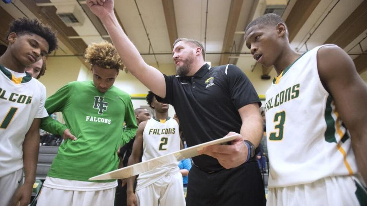 Foss head coach Mike Cocke directs the Falcons during a boys basketball game against Timberline at Foss High School in Tacoma on Nov. 29, 2016.