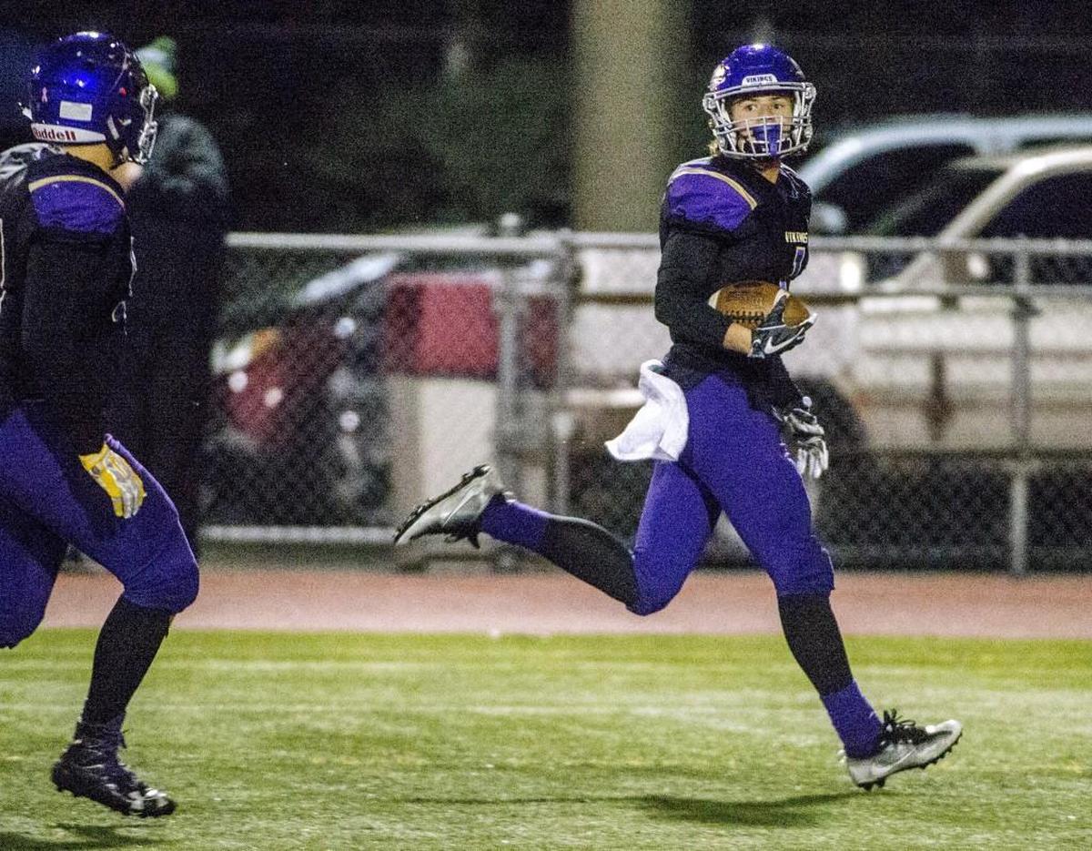 George Johnston of Puyallup High School runs back an interception against Auburn Mountainview for a touchdown in a 4A football game in Sparks Stadium in Puyallup, November 3, 2017.