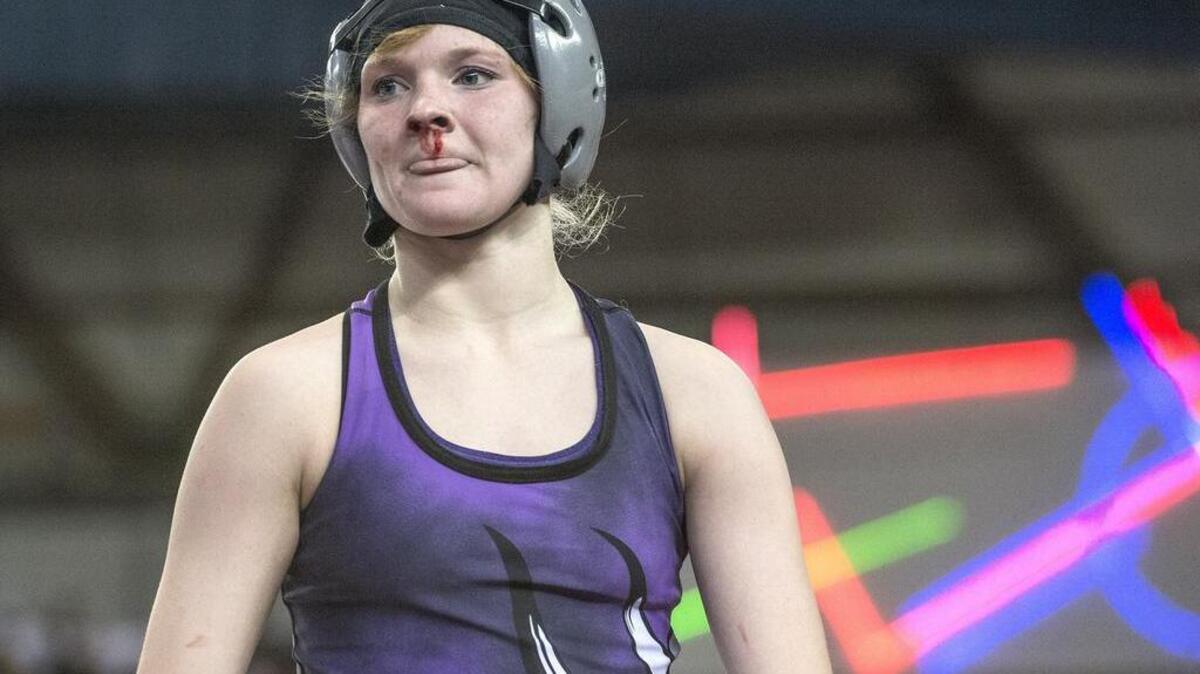Puyallup’s Jordyn Bartelson suffered a bloody nose but defeated Zillah’s Olyvia Smith in a 120-pound quarterfinal match Friday.