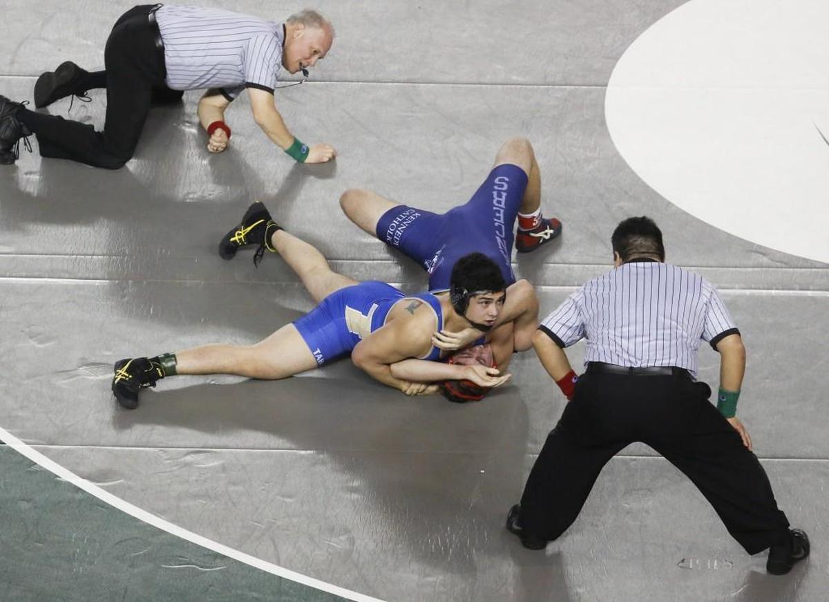 Tahoma's Kione Gill pins Kennedy Catholic's Bowen McConville in the 4A 195 pound championship match at Mat Classic XXIX at the Tacoma Dome in Tacoma, Wash., on Saturday, February 18, 2017.