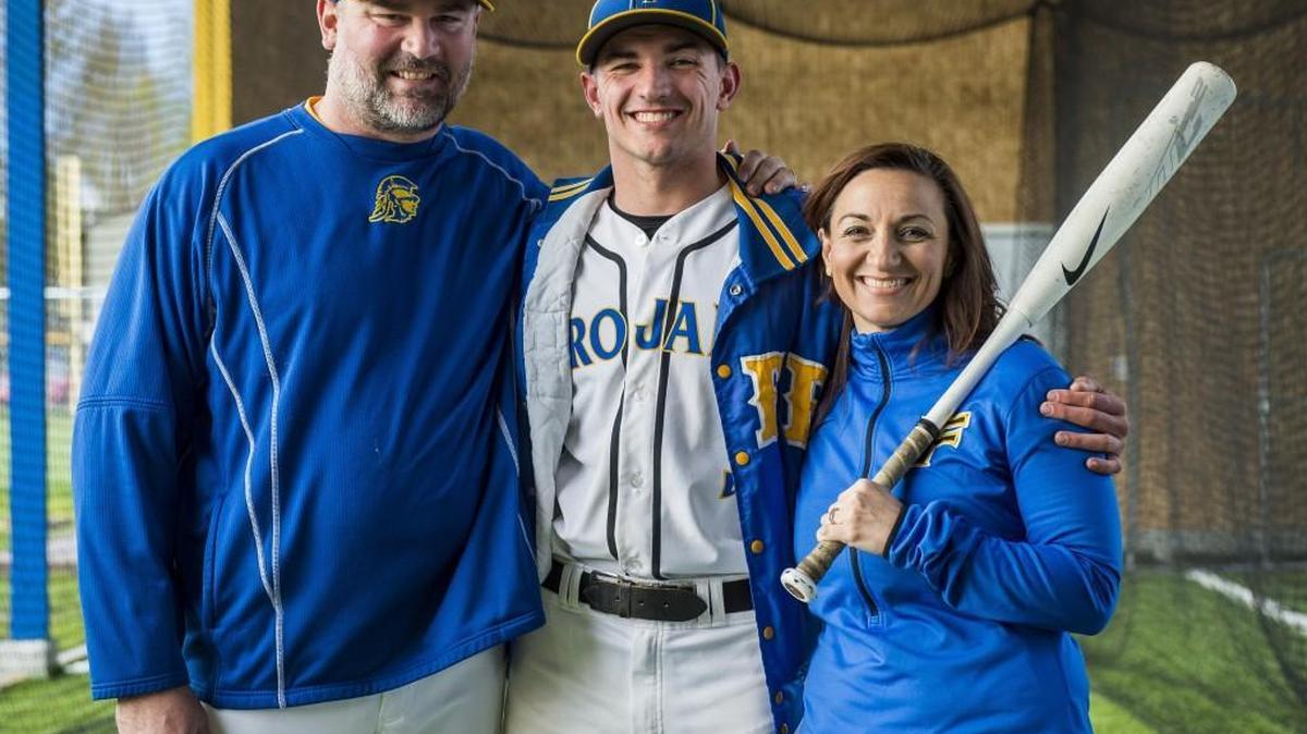 Wesley Nixon, a senior outfielder on the Fife High School baseball team, stands for a portrait with his parents Shane Nixon, the Fife High School baseball coach, and Michelle Nixon, who coaches the Fife softball team.
