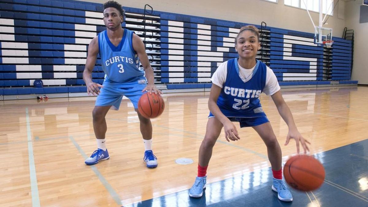 Aushanti Potts-Woods, left, and Jalaiya Frederick are the latest in a line of left-handed basketball stars for Curtis High School.