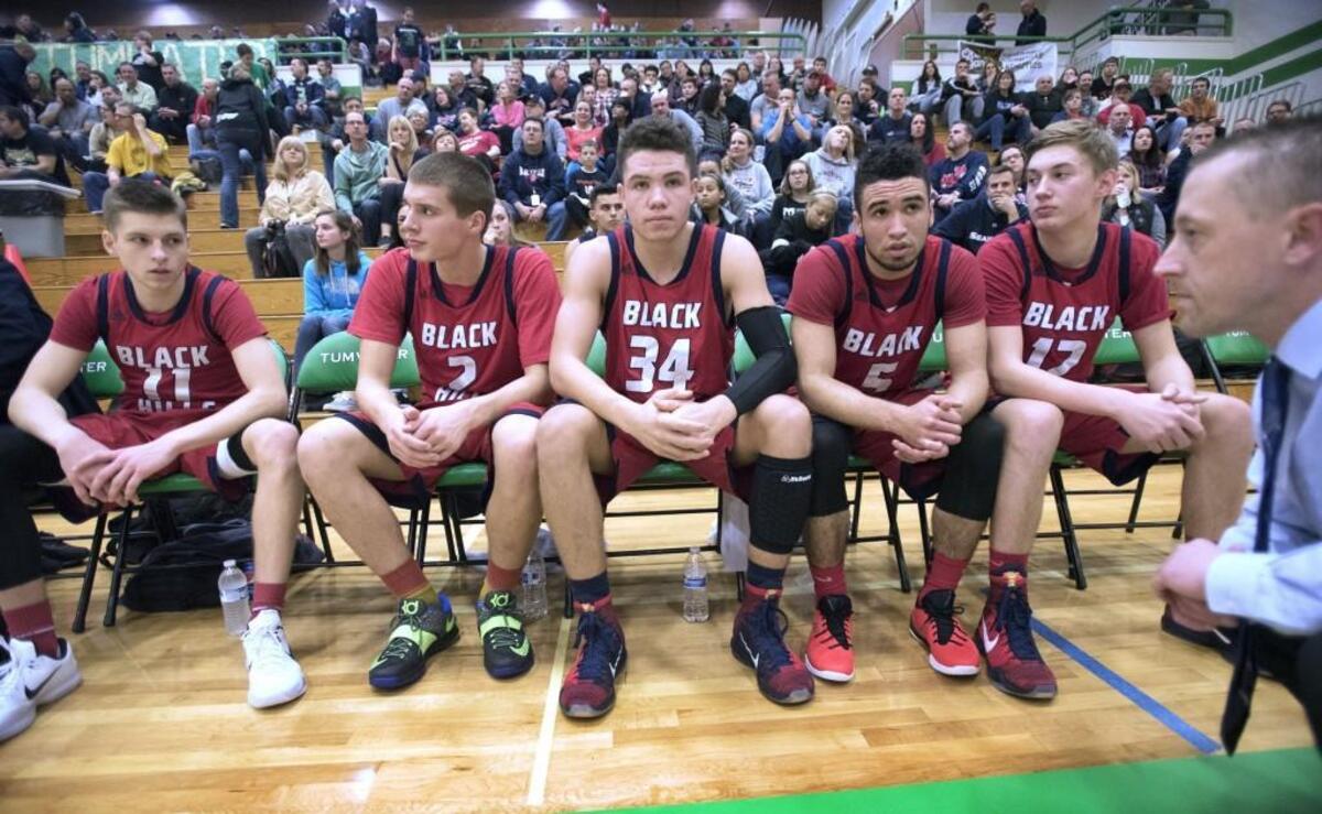 Black Hills starters (from left) TJ Mickelson, Noah Brewer, Jewell Day, Jason Underhill and Joe Crumley and head coach Jeff Gallagher wait for player introductions before Friday night's boys basketball game at Tumwater High School on Jan. 15, 2016.