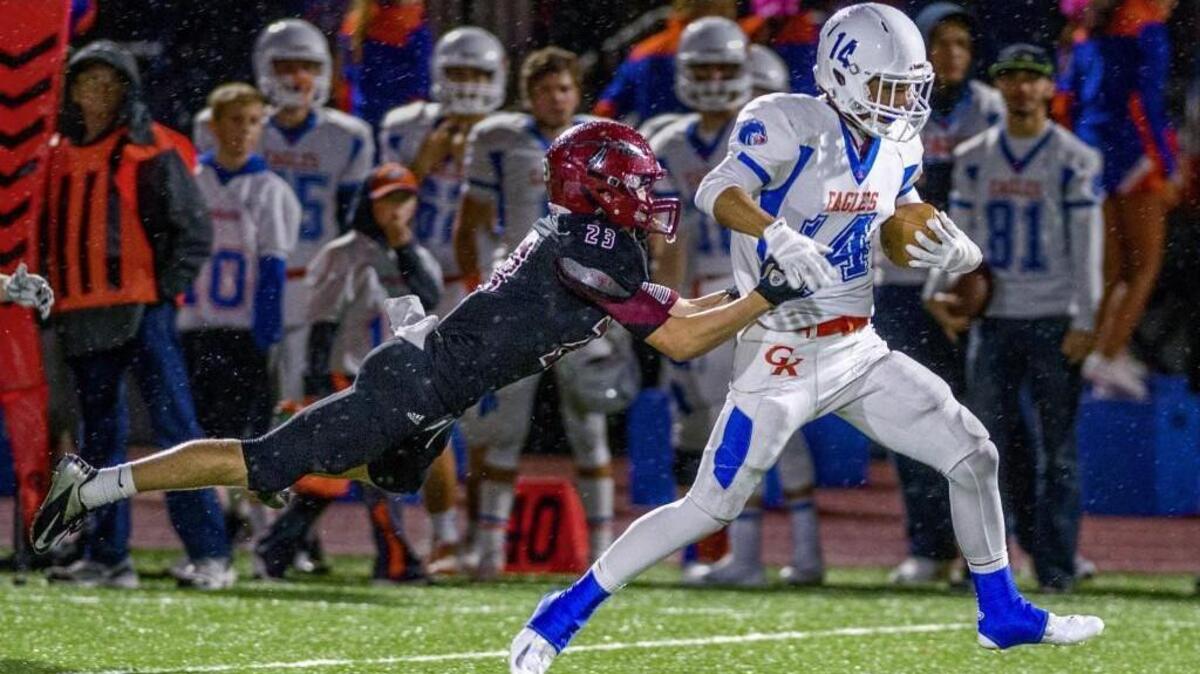 Elan Olmos of Graham-Kapowsin High School takes a reverse for a long trip to the end zone last week in a win over rival Bethel.