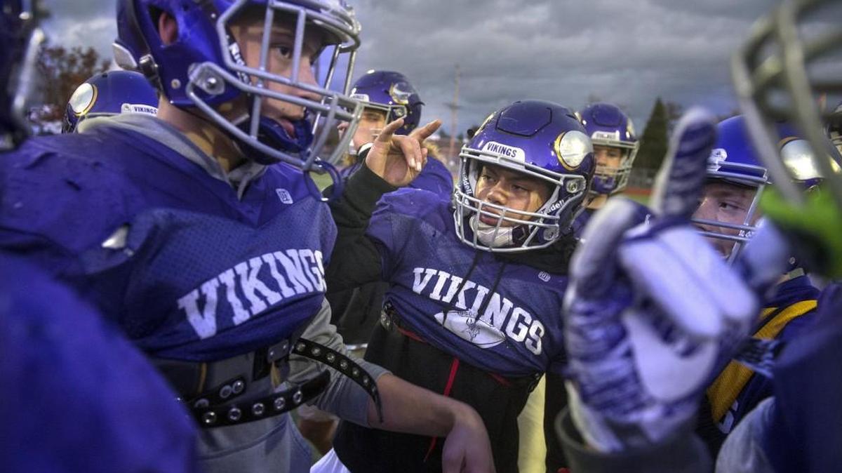 Puyallup senior Brendon "The Hype Man" Ngotel (center) fires up his Viking teammates during football practice at Sparks Stadium in Puyallup on Wednesday, Nov. 1, 2017.