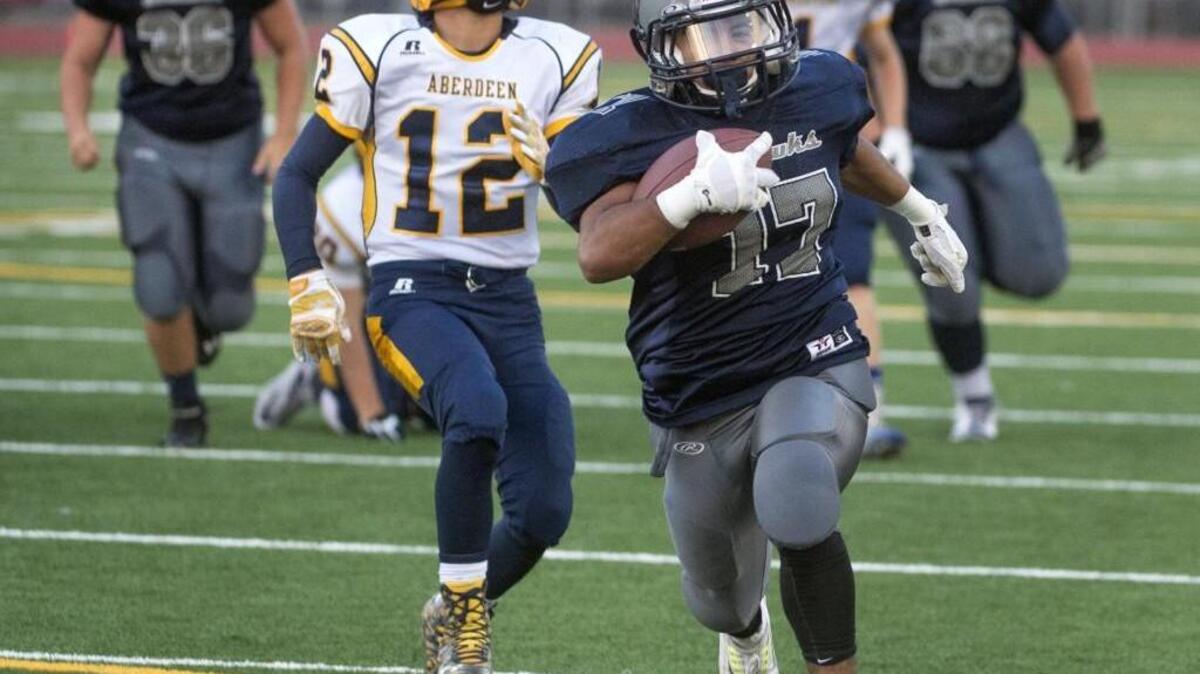 
River Ridge senior running back Gustavo Diaz runs for a touchdown touchdown against Aberdeen earlier this season.

