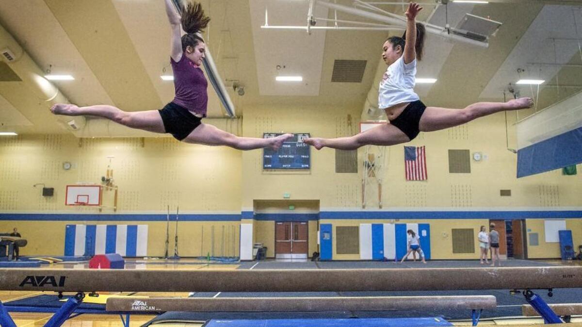Expectations are high for Mount Rainier High School gymnasts, Karissa Saelee, left, and Naleia Gomes going into state championships this week.