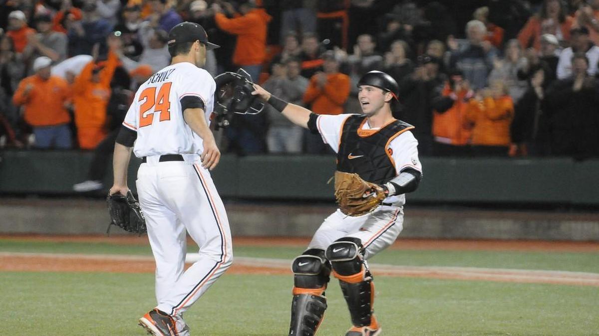Oregon State catcher Logan Ice congratulates pitcher Scott Schultz, left, after after the team defeated UC Irvine in an NCAA college baseball regional tournament game in Corvallis, Ore., Sunday, June 1, 2014.