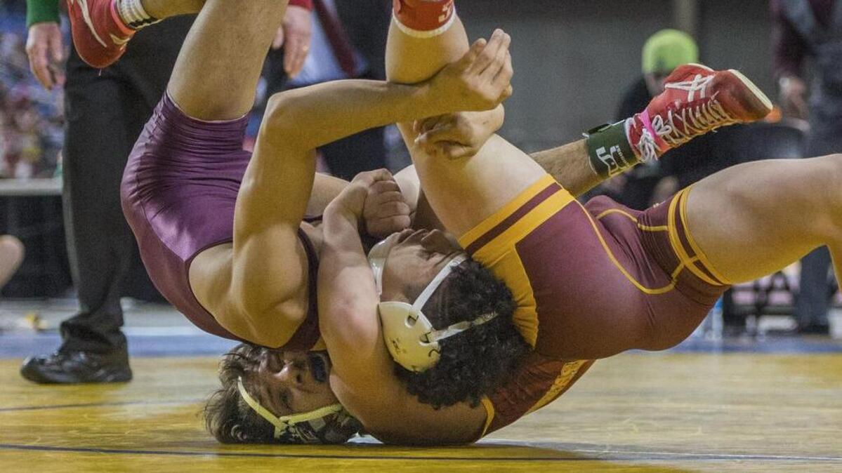 Gabe Hawthorne of White River is in charge of Alexei Rubio of Toppenish in the boys AA 132-pound weight class championship round of the Thirtieth Mat Classic state wrestling tournament held in the Tacoma Dome, February 17, 2018.
