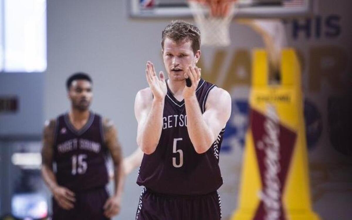 “When he’s (Matt Reid) in the lineup, we tend to talk a lot more on defense and we tend to execute a lot more offensively,” says Justin Lunt, UPS men’s basketball coach.