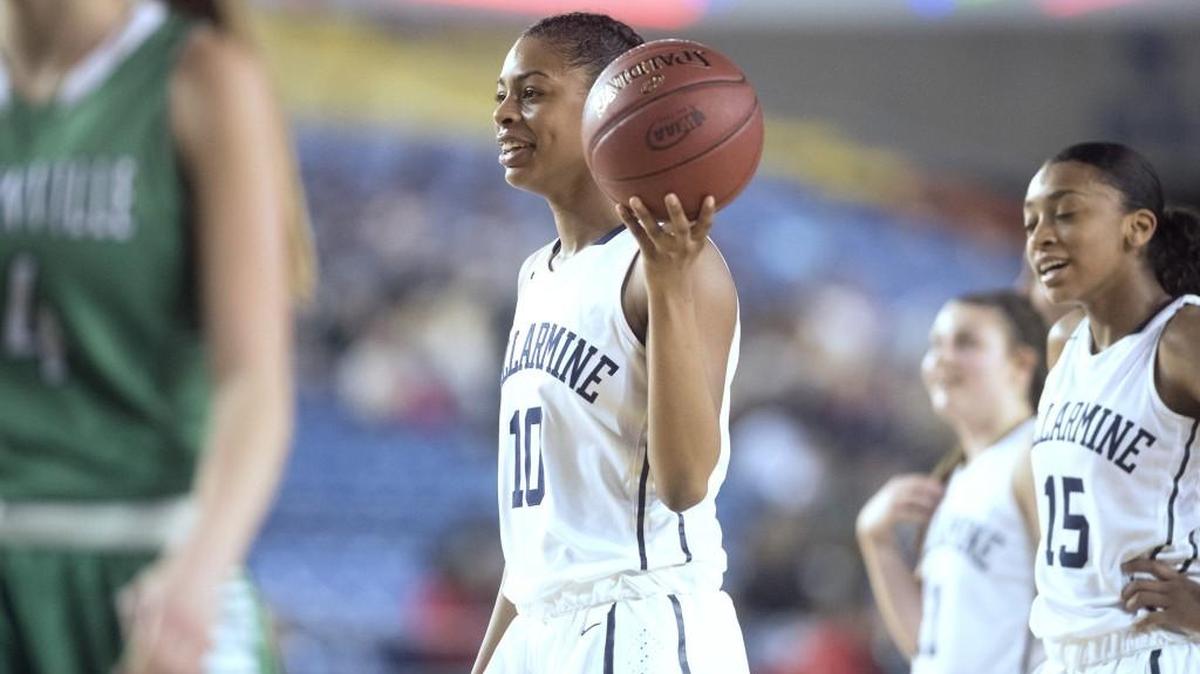 Bellarmine Prep's Shalyse Smith smiles as she goes to the foul line late in the Lions' 68-58 victory over the Woodinville Falcons during Wednesday afternoon's 4A girls basketball state tournament game in the TacomaDome on March 1, 2017.
