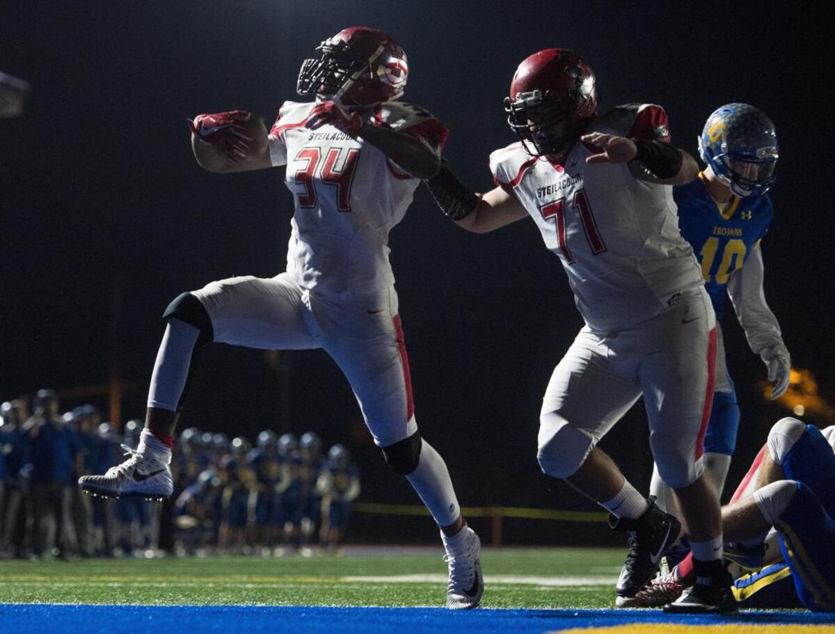 Steilacoom’s Jaymason Willingham (34) runs into the end zone for a touchdown in the second quarter. Blocking is Eric Bernal (71). Fife played Steilacoom in a football game at Fife High School in Fife, Wash., on Friday, Oct. 27, 2017.