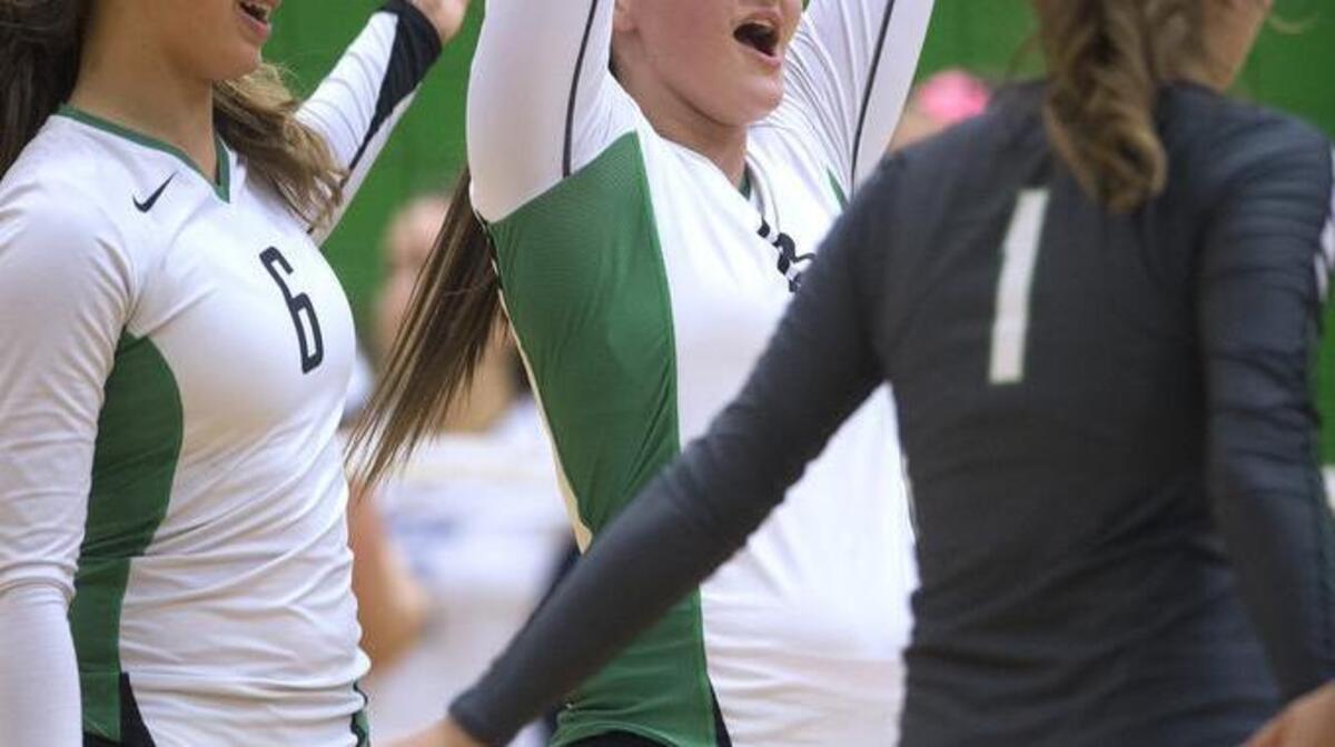 Tumwater’s Bella Najarro, center, celebrates during Thursday’s match against Olympia. Najarro, who missed much of last season after an appendectomy, had six kills.