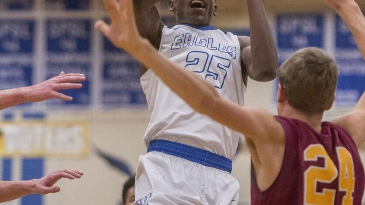 Malcom Cola of Federal Way High School heads for the basket in a boys basketball game against Enumclaw, December 13, 2016.