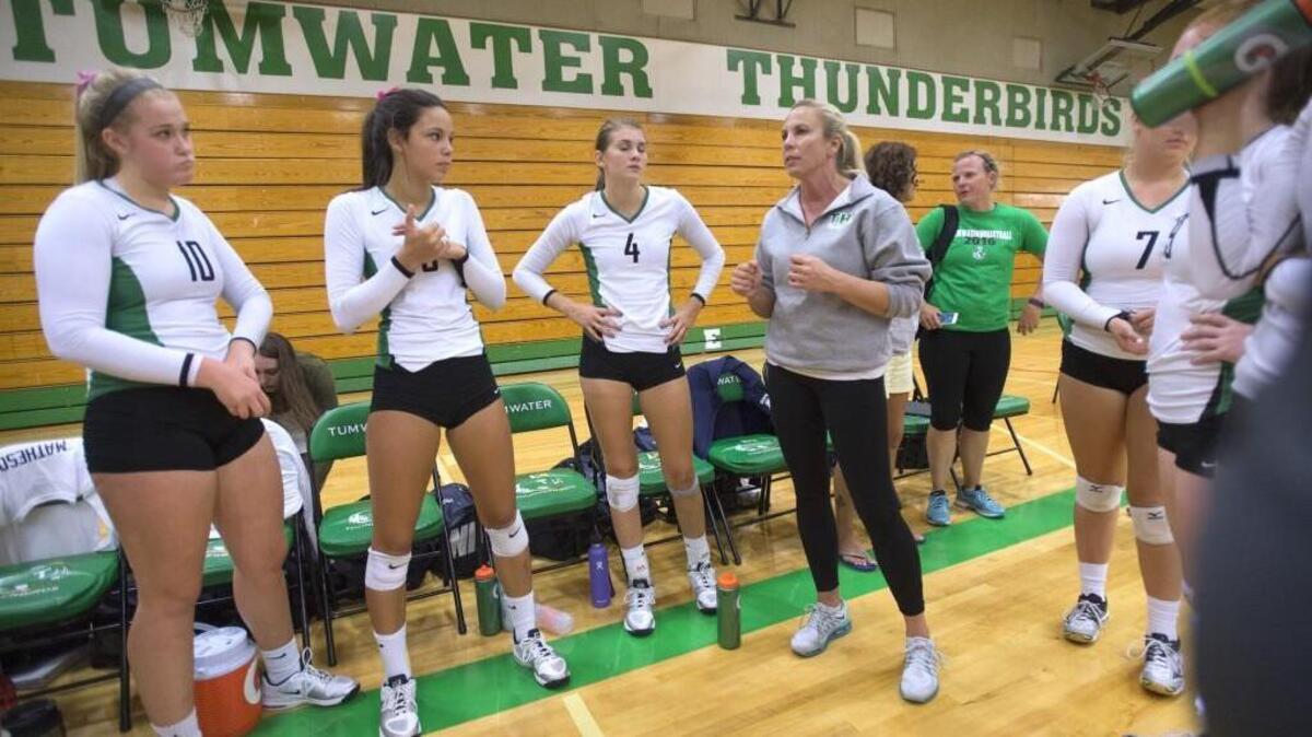 Tumwater coach Tana Otton directs the T-Birds in a time-out during Thursday night's volleyball match against the Olympia Bears at Tumwater High School on Sept. 15, 2016.