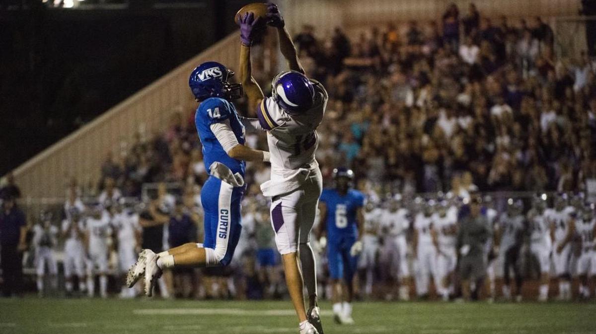 Puyallup's Darius Morrison makes a catch over Curtis' Jordan Parker in the fourth quarter. Puyallup played Curtis at Curtis High School in Tacoma, Wash., on Friday, September 1, 2017.