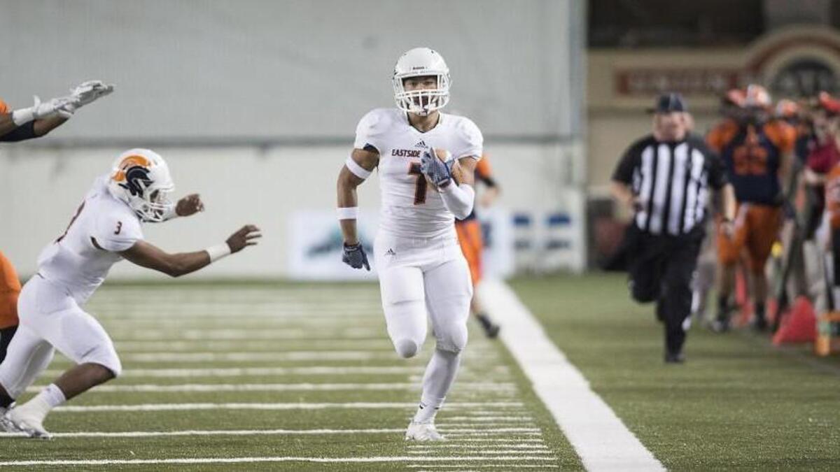 Eastside Catholic kick returner Brandon Wellington takes the opening kickoff back for a touchdown during the 3A football state semifinal game against the Lakes Lancers at the TacomaDome on Friday, Nov. 27, 2015. The Crusaders jumped out to a 28-0 first quarter lead and never looked back en route to a 49-21 victory.