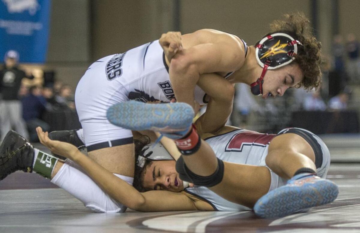 Yusief Lille of Bonney Lake on his way to beating Donnie Krissak of Bethel in the boys AAA 106-pound weight class championship round of the Thirtieth Mat Classic state wrestling tournament held in the Tacoma Dome, February 17, 2018.
