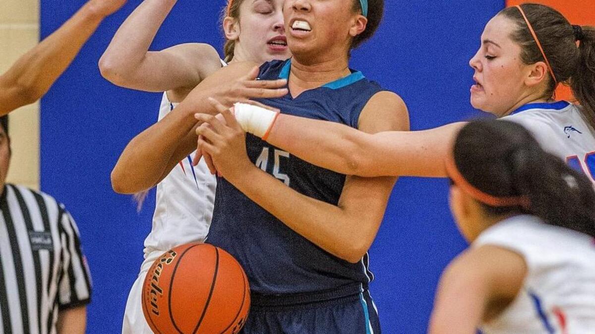 Riverside center Faith Turner, who is 6-foot-3, is swarmed by a host of Mountainview defenders on a rebound attempt Friday.