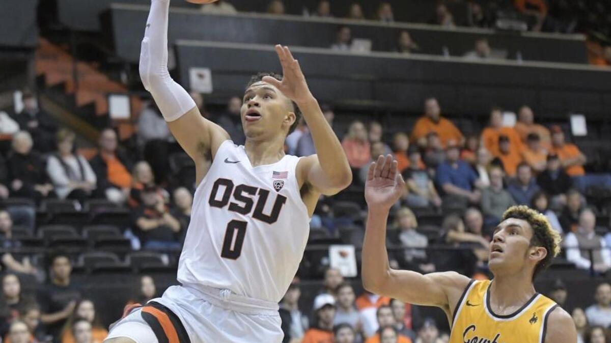 Oregon State's JaQuori McLaughlin drives past Wyoming's Hunter Maldonado during an NCAA college basketball game Monday, Nov. 13, 2017, in Corvallis, Ore. (Andy Cripe/The Corvallis Gazette-Times via AP)
