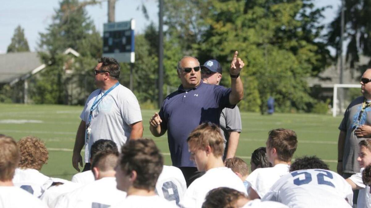 First-year Gig Harbor coach George Fairhart talks to his team during his first practice with them on Wednesday.