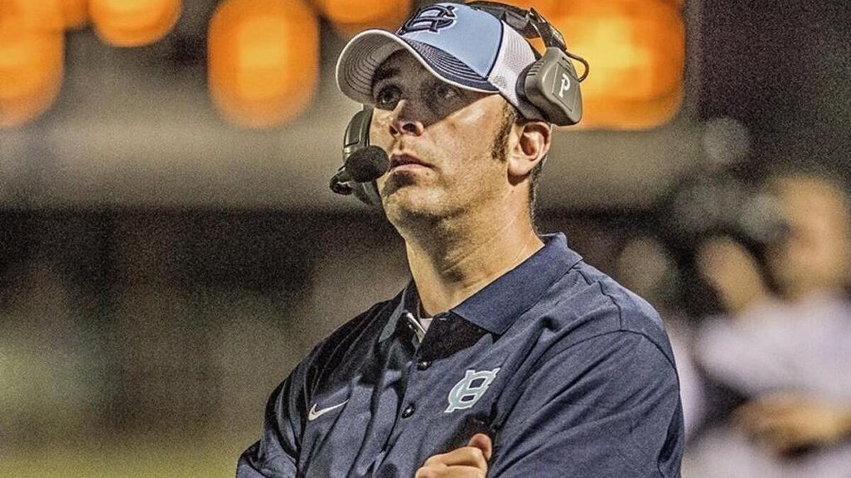 Gig Harbor head coach Aaron Chantler waits for the final whistle after his Tides demolished the Seahawks of Peninsula High School at the 37th edition of the Fishbowl at Roy Anderson Field in Purdy Friday Aug. 4, 2015.