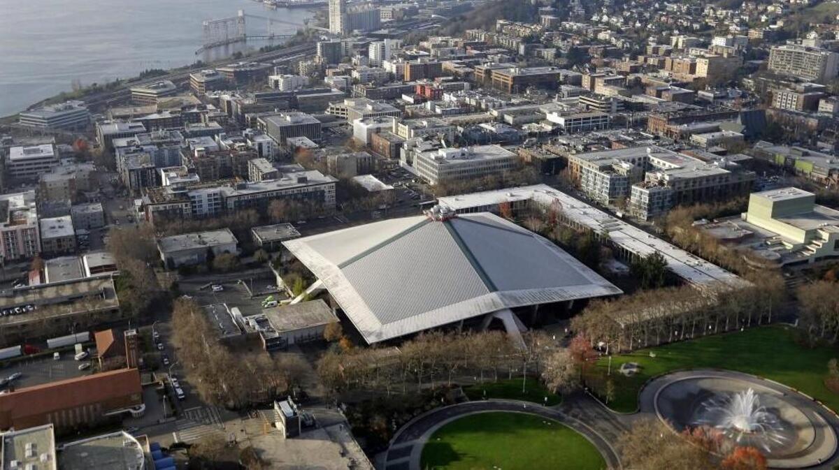 The iconic sloped roof of KeyArena is seen from above on Monday. The Seattle City Council on Monday approved a memorandum of understanding with Los Angeles-based Oak View Group in a $600 million privately financed project to renovate the facility, which could become home to an NHL team in 2020.