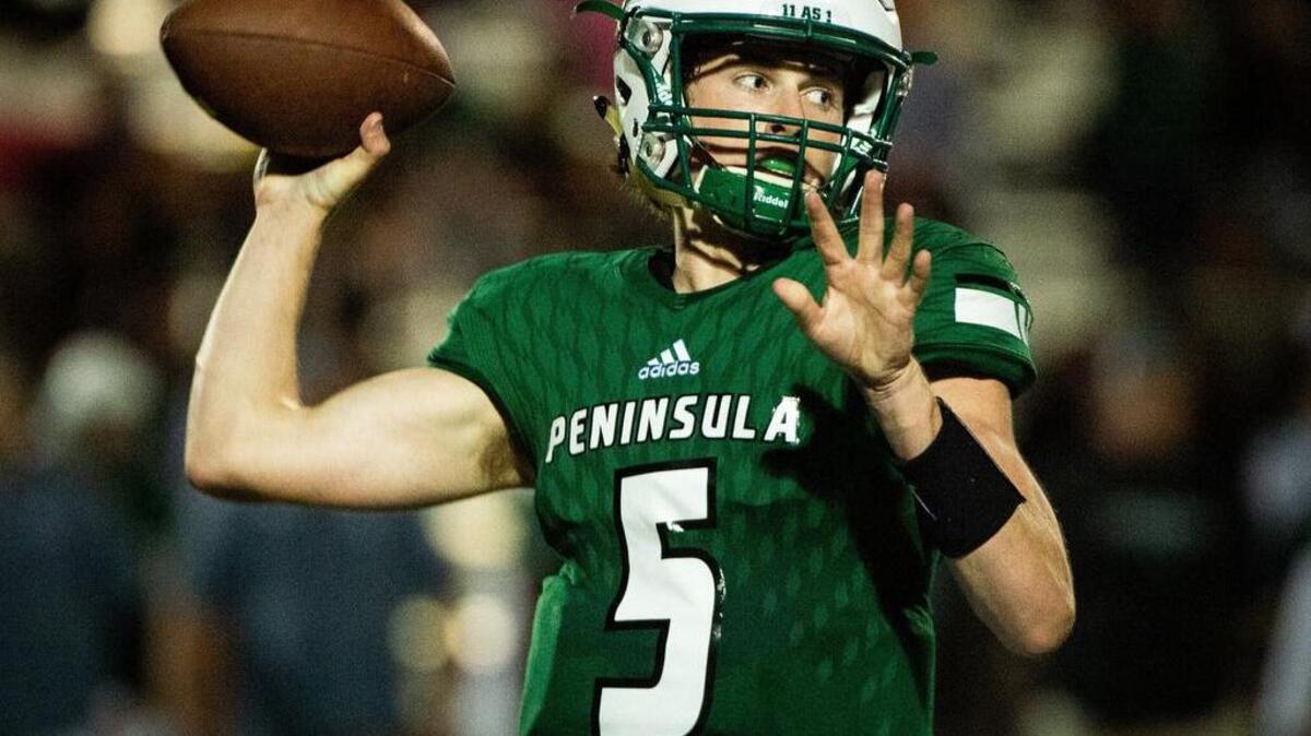Peninsula’s Burke Griffin (5) passes in the fourth quarter. Peninsula High School played Timberline High School in a football game at Roy Anderson Field in Purdy, Wash., on Thursday, Sept. 27, 2018.