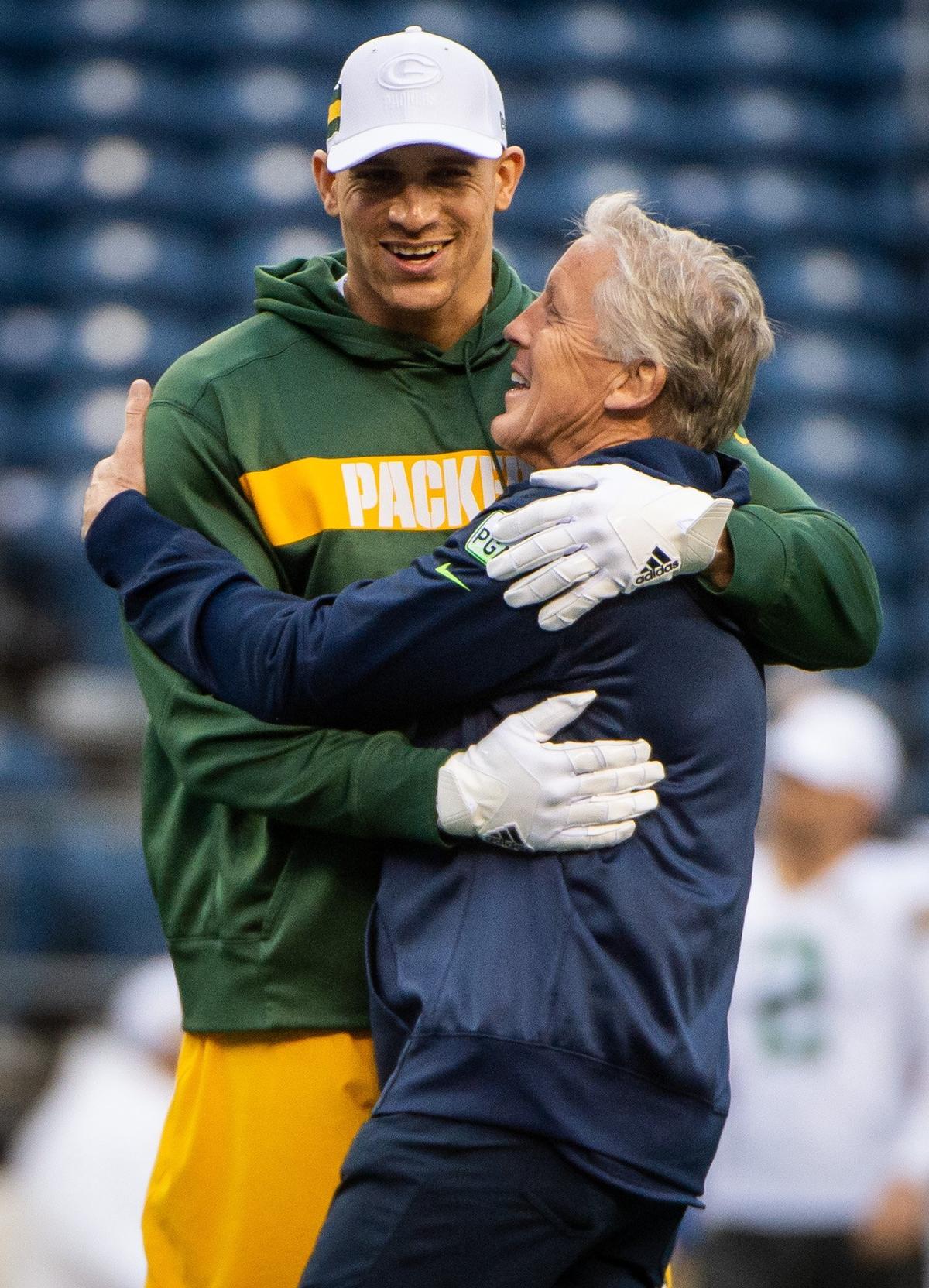 Packers tight end Jimmy Graham and Seahawks Head Coach Pete Carroll embrace during warmups before the game. The Seattle Seahawks played the Green Bay Packers in a NFL football game at CenturyLink Field in Seattle, Wash., on Thursday, Nov. 15, 2018.