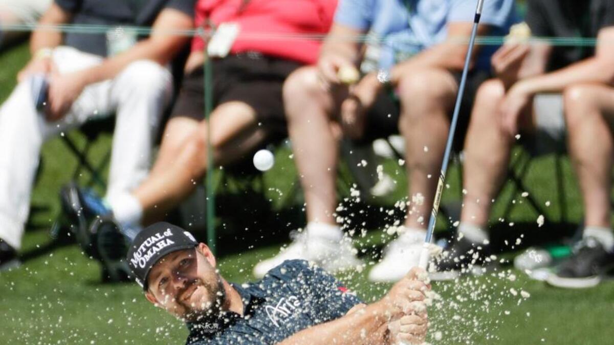 Ryan Moore hits from a bunker on the second hole during the final round of the Masters tournament Sunday in Augusta, Ga. Moore finished tied for ninth place after going 2 over on the day.