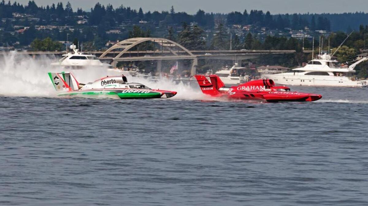 
J. Michael Kelly in the Graham Trucking boat, right, and Jimmy Shane in the Oberto boat battled nearly deck to deck for five laps Sunday on Lake Washington.


