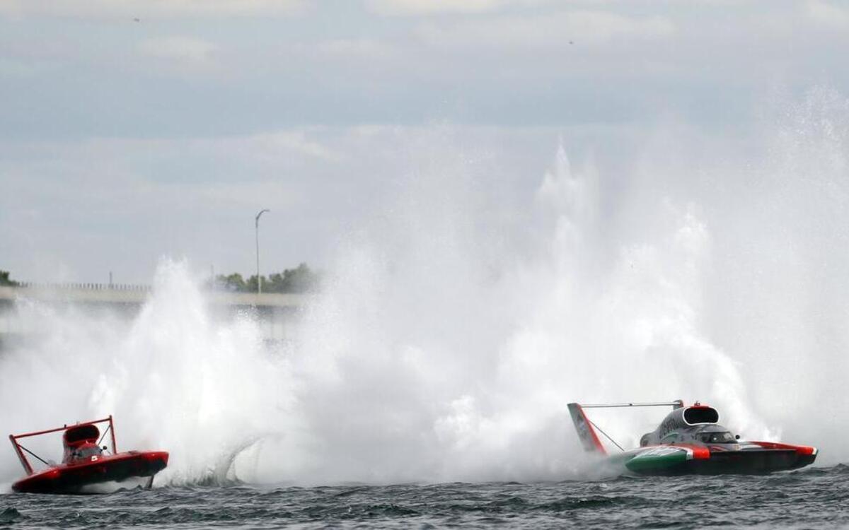 
Jimmy Shane, in the U-1 Oberto, right, moves past J. Michael Kelly, in the U-5 Graham Trucking, after turn two on the Columbia River on Sunday during the final lap of the HAPO APBA Gold Cup race in Kennewick. Shane won the Gold Cup. 
