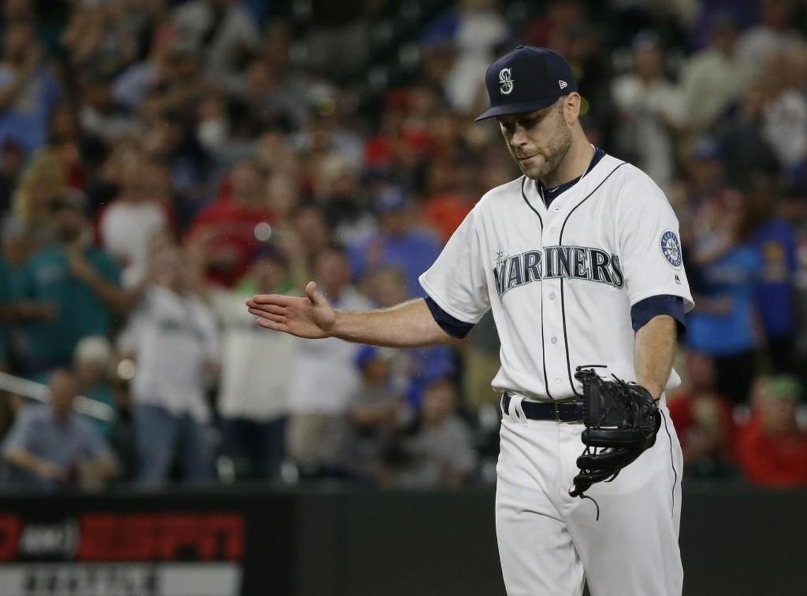Seattle Mariners pitcher David Phelps claps his hand into his glove at the end of the ninth inning against the Boston Red Sox on July 24, 2017. He pitched 8 2/3 innings for the Mariners after the July 20 trade from Miami before undergoing season-ending surgery to remove a bone spur on Sept. 13.