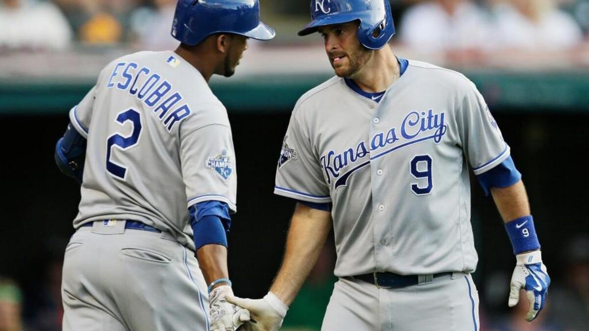 Kansas City’s Drew Butera (9) is congratulated by Alcides Escobar after hitting a solo home run against Cleveland on Friday.