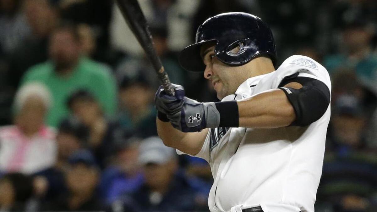 
Jesus Montero of the Mariners hits a three-run homer against the Angels on Wednesday at Safeco Field.
