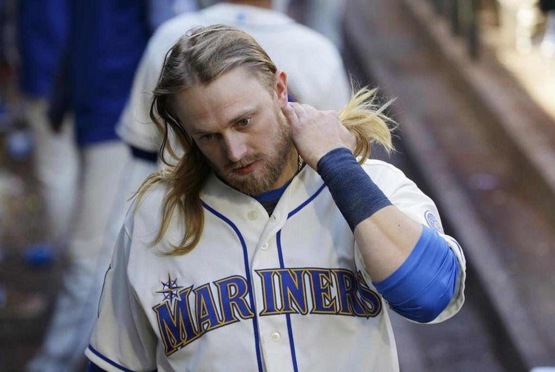 Seattle Mariners' shortstop Taylor Motter walks in the dugout after the seventh inning of a baseball game against the Cleveland Indians, Sunday, Sept. 24, 2017, in Seattle. The Mariners lost 4-2, eliminating them from post-season play. (AP Photo/Ted S. Warren)