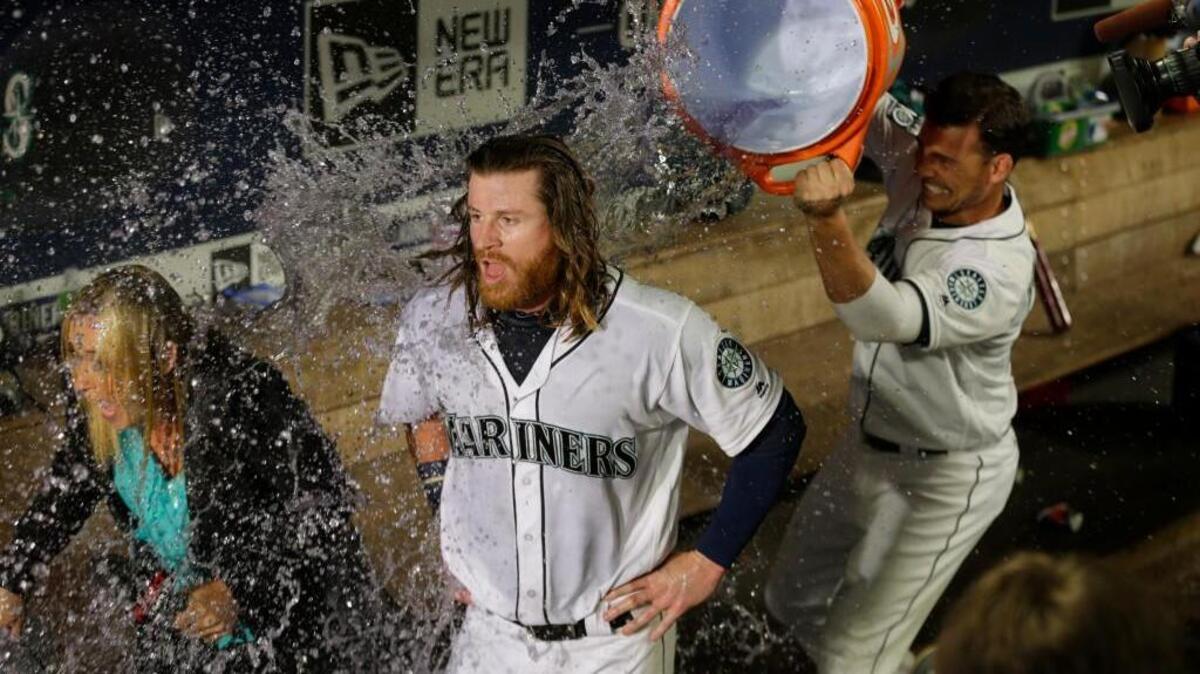Danny Valencia’s attempt to douse teammate Ben Gamel, who scored the winning run in Saturday’s victory, was, um, poorly aimed. The result was a drenching for Root Sports reporter Angie Mentink, who took it like a champ. Angie completed the interview. Sa-lute!