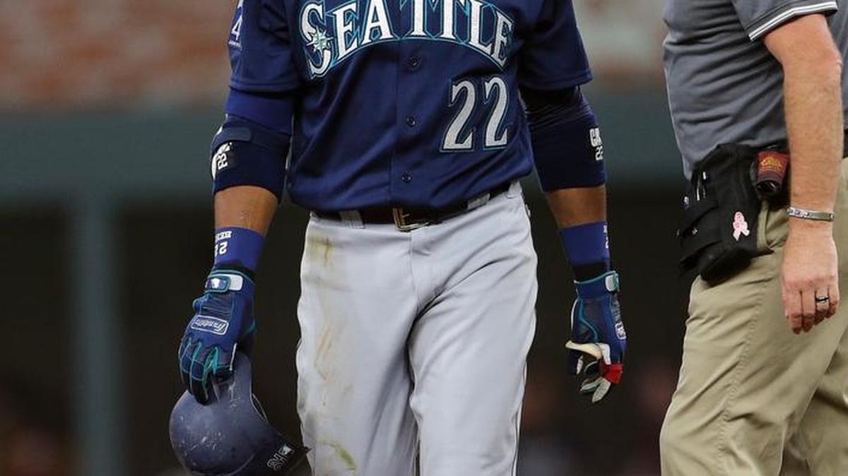 Robinson Cano limped from the field Wednesday in Atlanta accompanied by trainer Rob Nodine.